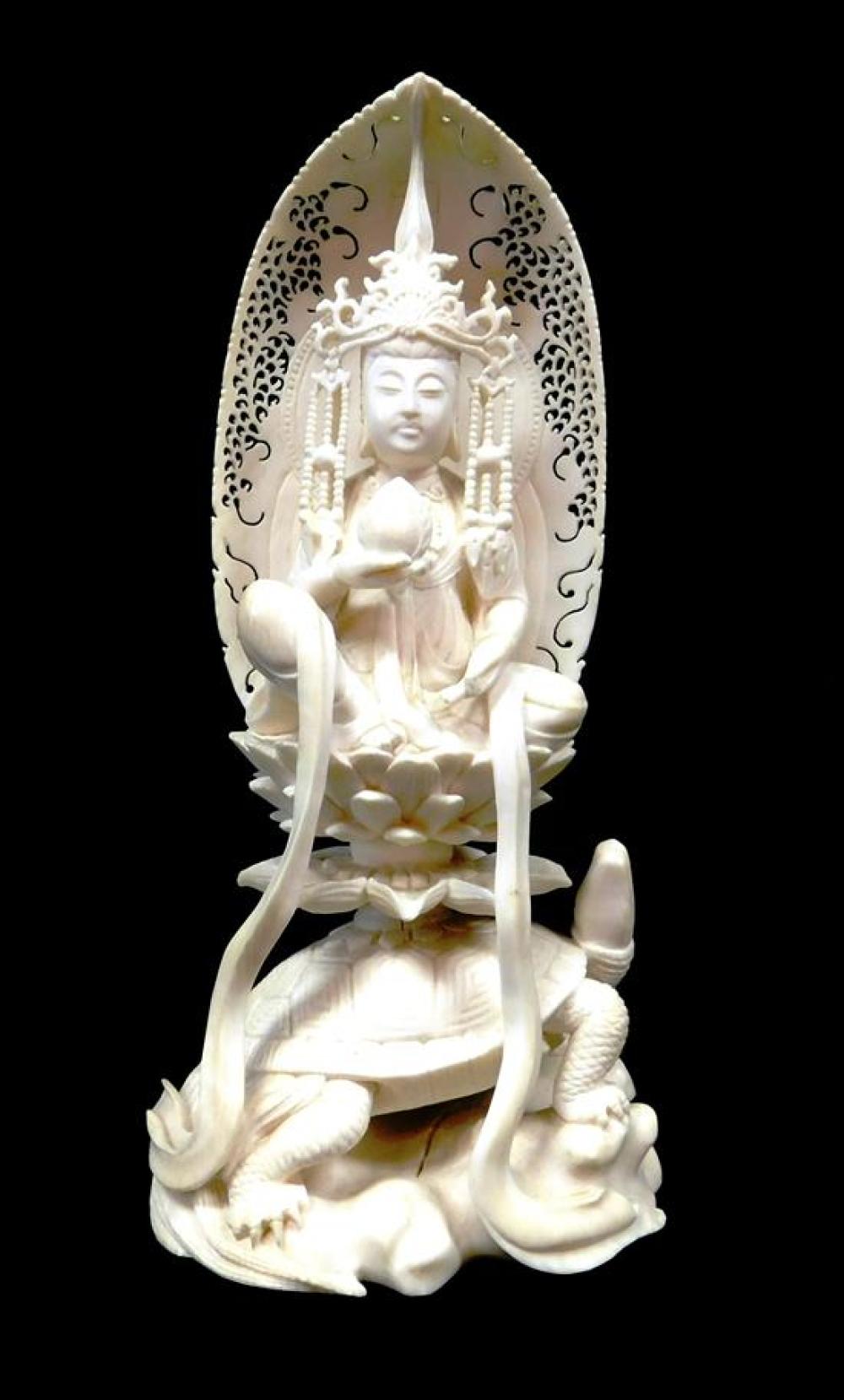 Appraisal: ASIAN Chinese carved ivory Buddhist figure seated on lotus petal