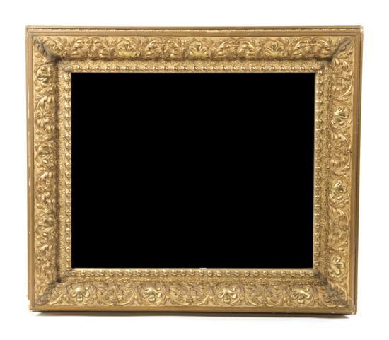 Appraisal: Victorian Giltwood Mirror the rectangular plate within a foliate carved