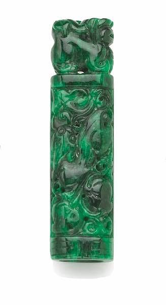 Appraisal: A carved jade feather holder Of ovoid section and deeply