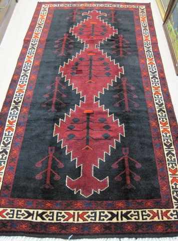 Appraisal: PERSIAN ILATI TRIBAL CARPET featuring a column of three interconnected