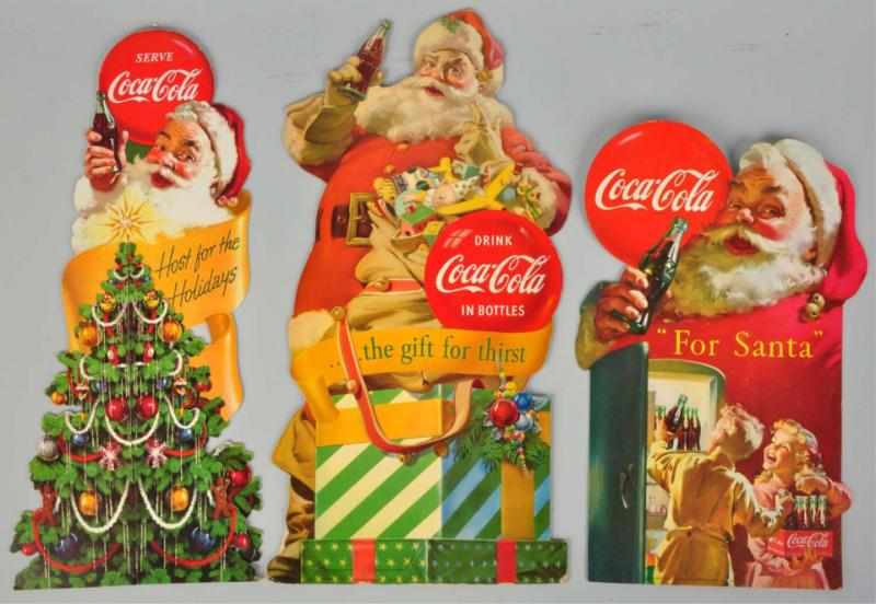 Appraisal: Lot of Cardboard Coca-Cola Santa Cutouts and All three pieces