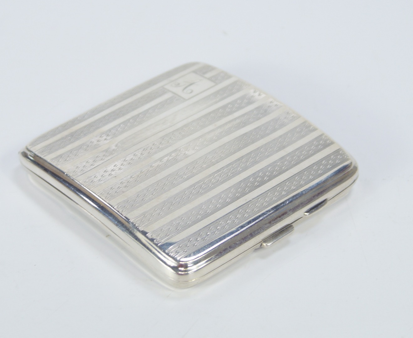 Appraisal: A George V engine turned silver cigarette case bearing the