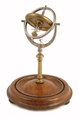 Appraisal: A Victorian steel and brass gyroscope on a turned mahogany