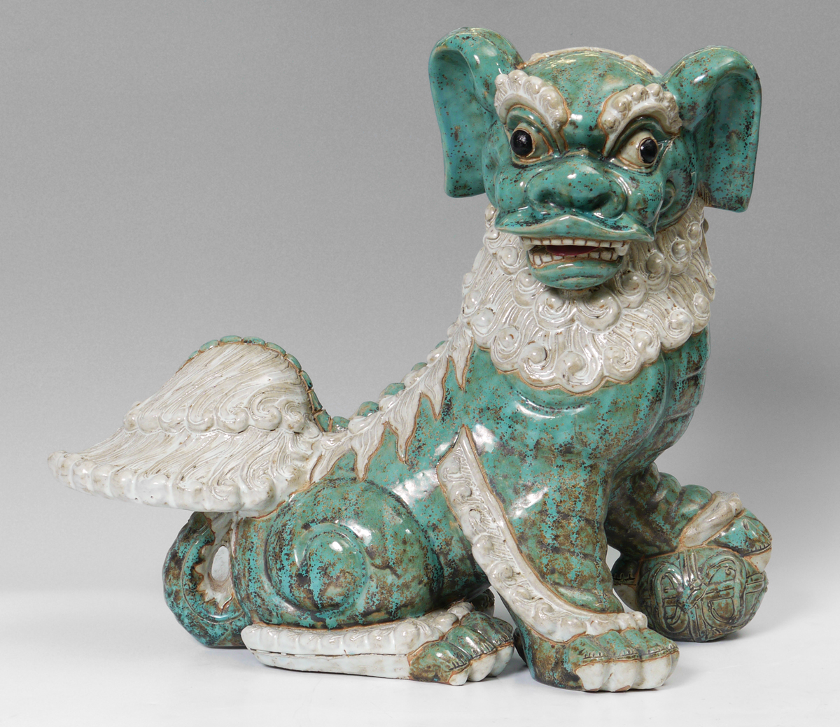 Appraisal: LARGE CHINESE EARTHENWARE FOO DOG With a realistic turquoise and