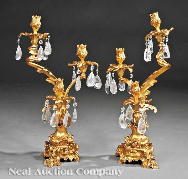 Appraisal: A Pair of Bronze Dor Three-Light Candelabra of scrolled acanthus