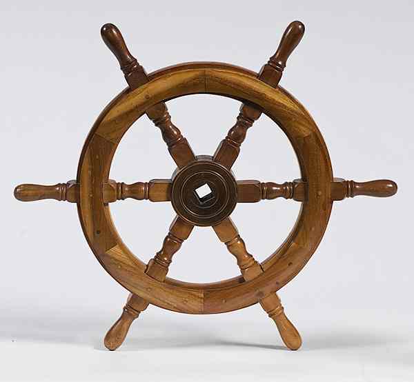 Appraisal: Walnut Ship's Wheel Contemporary with block and turned spokes the