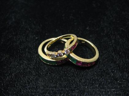 Appraisal: Three gem set stacking rings Two identical ruby and emerald