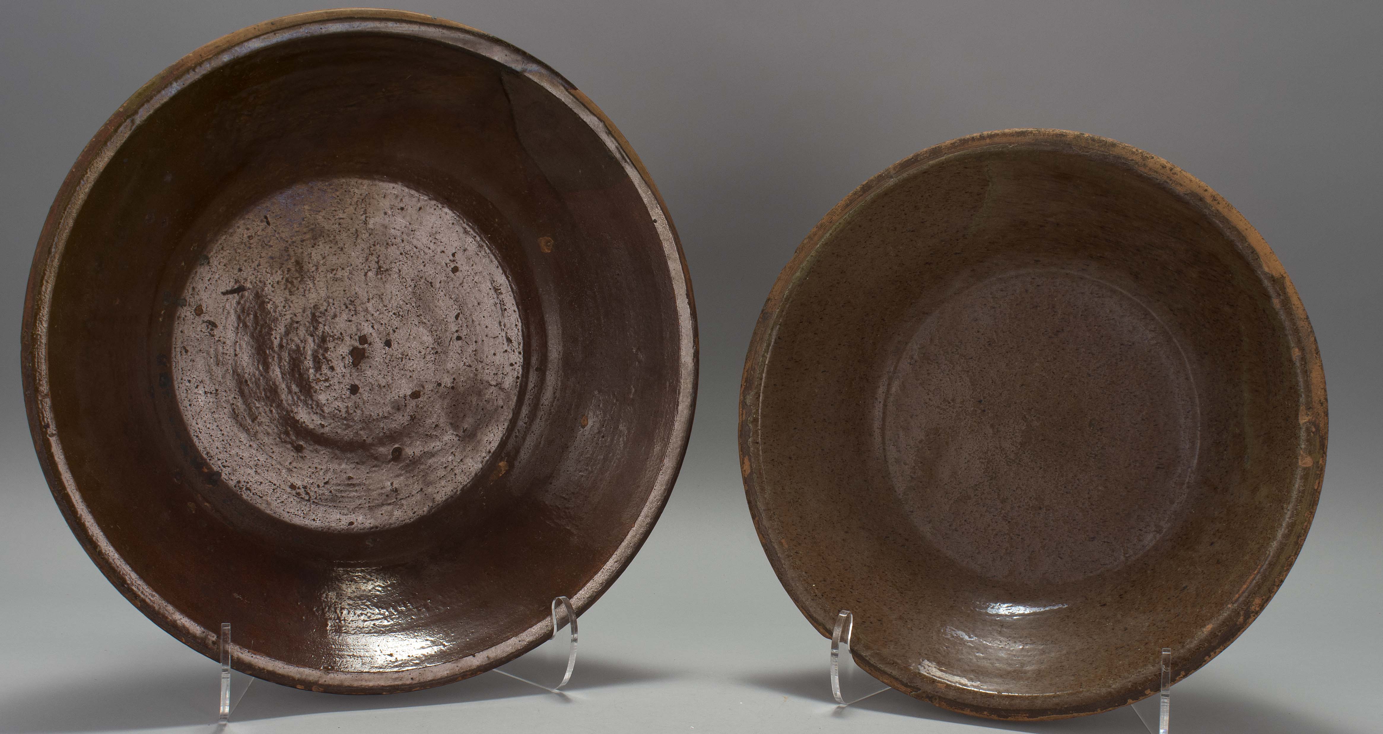 Appraisal: TWO REDWARE SHALLOW BOWLS Probably American th CenturyGlazed interiors Diameters