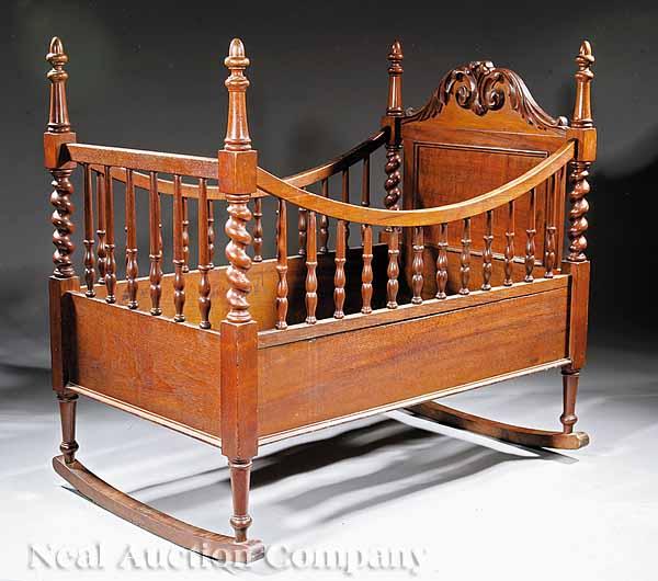 Appraisal: An American Rococo Carved Walnut Crib mid- th c acorn