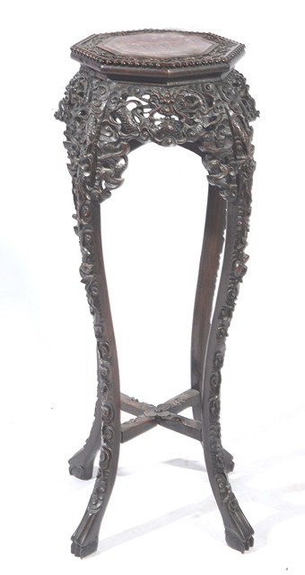 Appraisal: A CHINESE TALL CARVED URN STAND with octagonal top inset