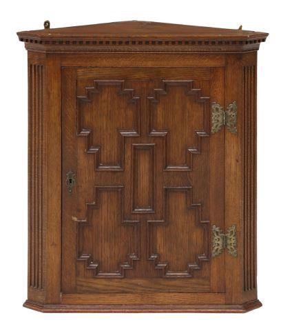 Appraisal: English Edwardian oak hanging corner cupboard early th c molded