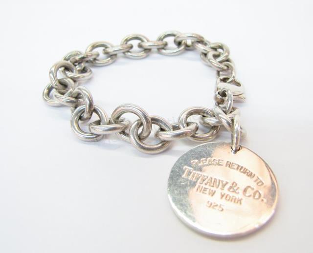 Appraisal: A Tiffany Co sterling silver round tag charm bracelet Please