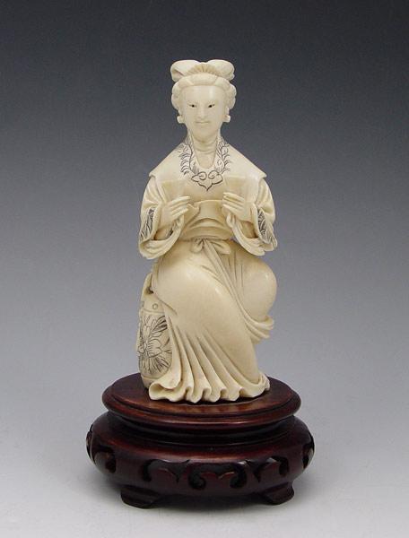 Appraisal: CHINESE CARVED IVORY FIGURE Figure of a woman holding libation