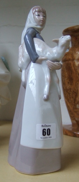 Appraisal: A Lladro figure modeled as a young girl holding a