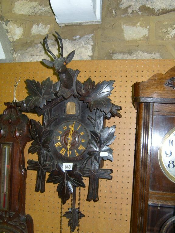 Appraisal: A late th century cuckoo clock of usual chalet form