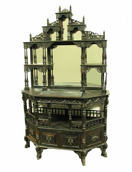 Appraisal: An Anglo Indian carved and ebonized etagere height ft in