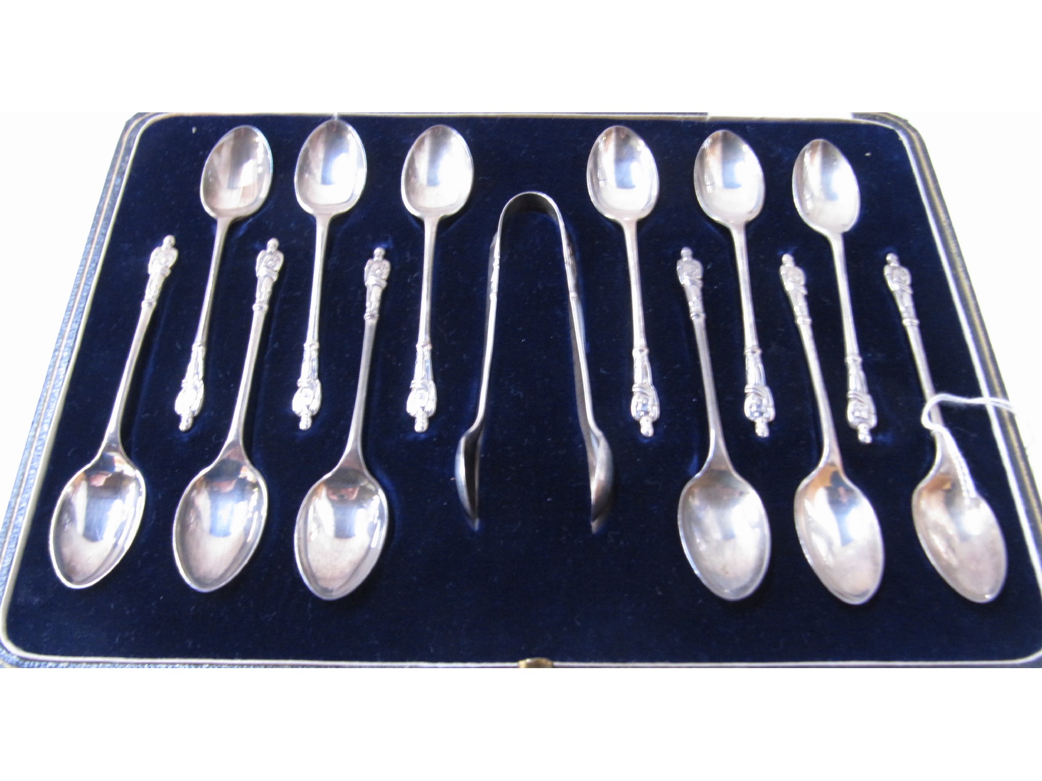 Appraisal: A cased set of twelve silver apostle spoons with tongs