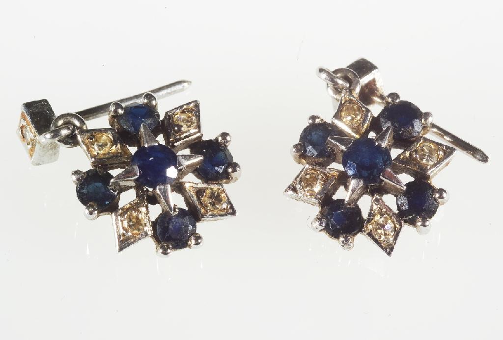 Appraisal: PAIR OF SAPPHIRE AND DIAMOND EARRINGS of star design the