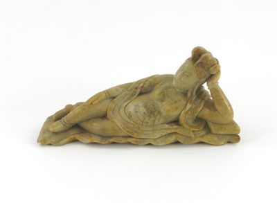 Appraisal: A Chinese steatite figure of a reclining woman wearing an