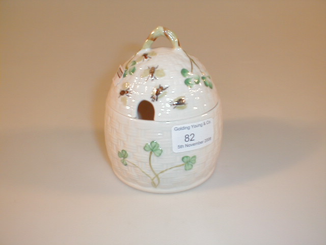 Appraisal: A Belleek honey pot white ground with green shamrock leaves