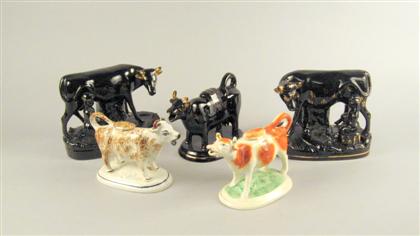 Appraisal: Five Staffordshire cow figure groups th century Comprising three single