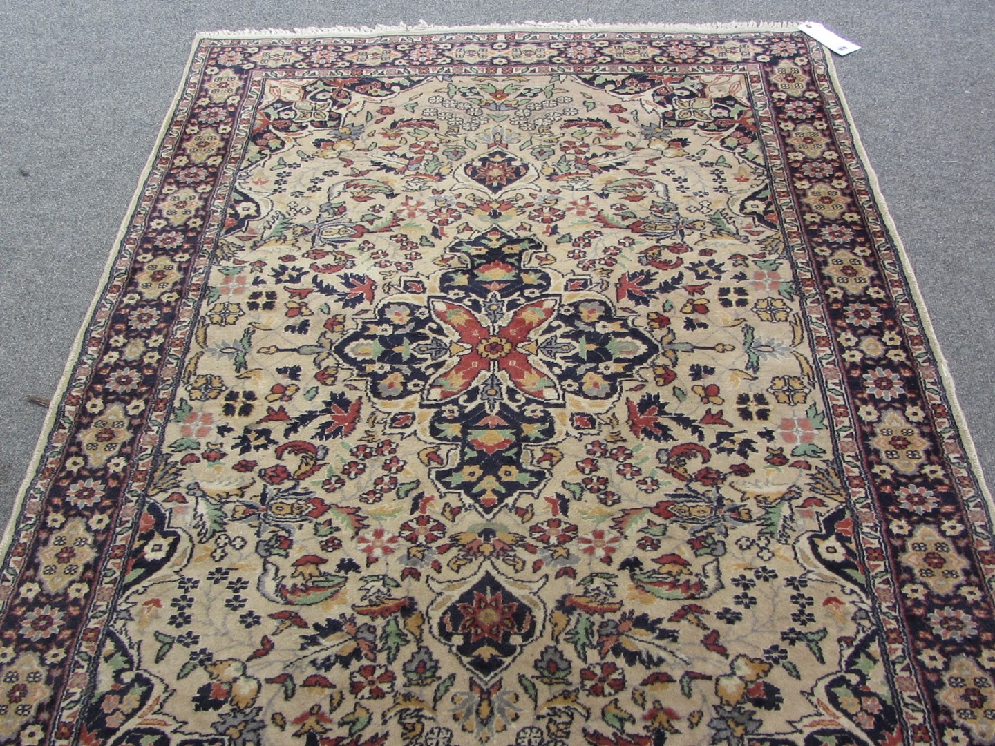 Appraisal: A Sarough rug Persian the ivory field with a black