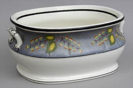 Appraisal: ENGLISH PAINTED POTTERY TWO-HANDLED OVAL FOOT BATH The bowl with