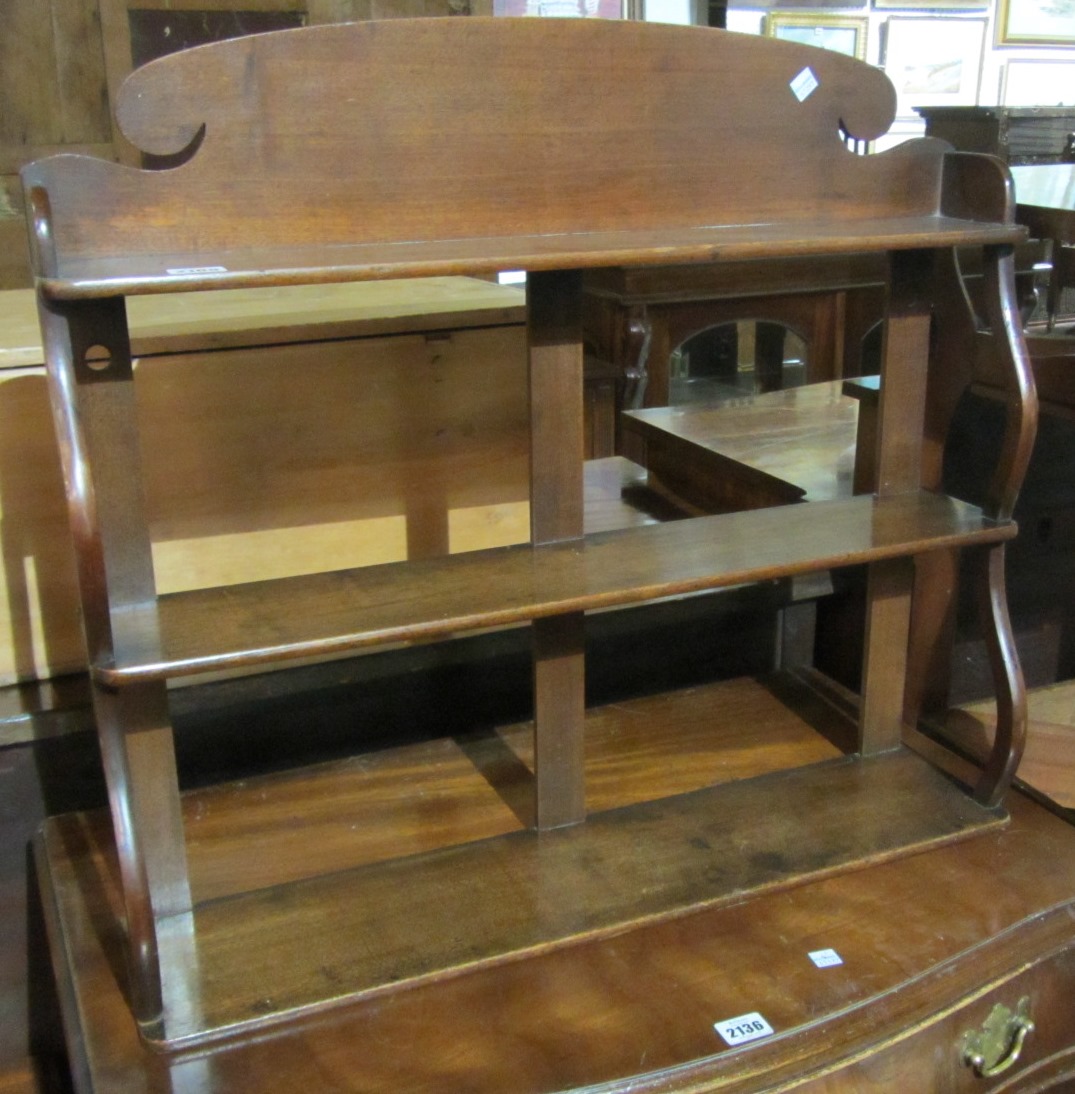 Appraisal: A th century mahogany three tier wall shelf