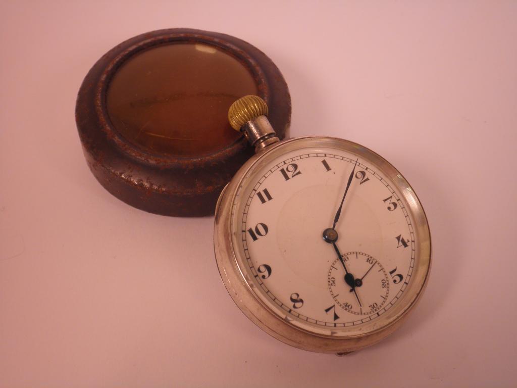 Appraisal: A silver pocket watch with an iron outer case