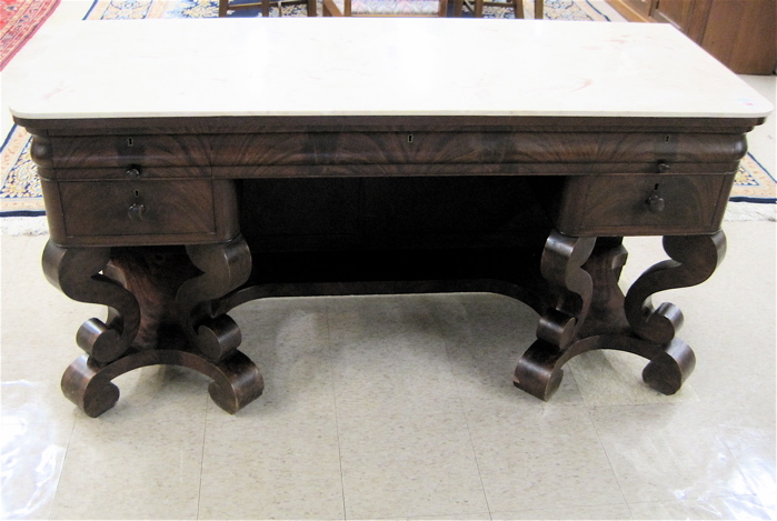 Appraisal: EMPIRE MAHOGANY DRESSING TABLE late Classicism style pillar-and-scroll design American