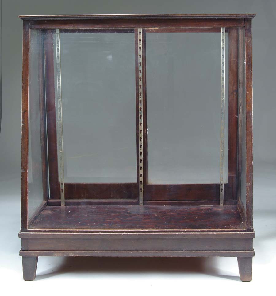 Appraisal: STORE FLOOR STANDING SLANT FRONT SHOWCASE Glass display case includes