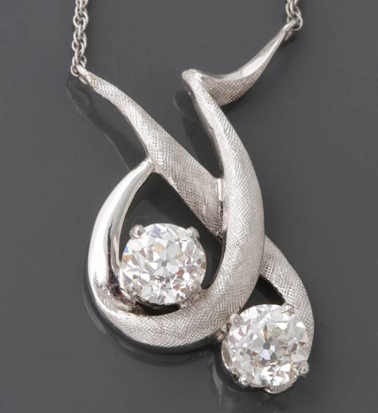 Appraisal: A diamond and white gold necklace set with two old