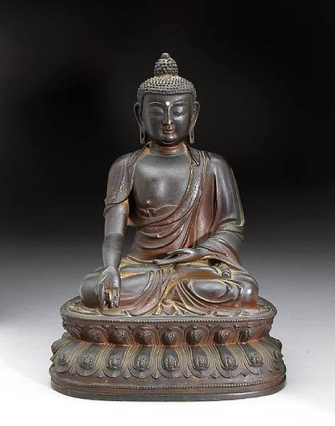 Appraisal: A bronze seated Buddha th Century His forehead inlaid with