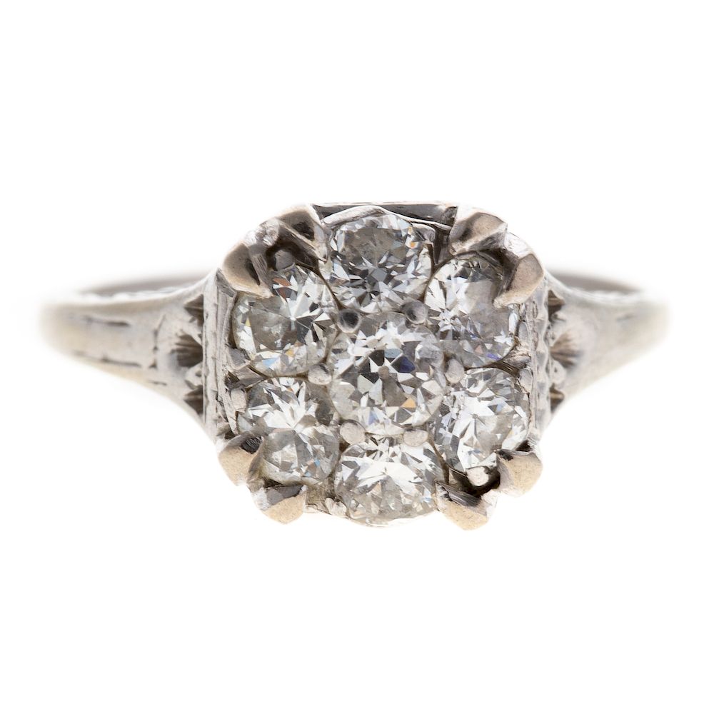 Appraisal: A Vintage Diamond Cluster Ring in Platinum Platinum engraved setting