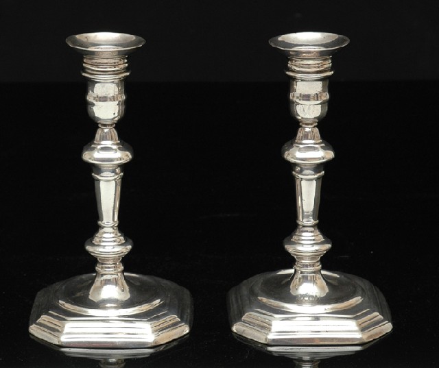 Appraisal: A PAIR OF GEORGE I BRITANNIA STANDARD CAST CANDLESTICKS Maker's