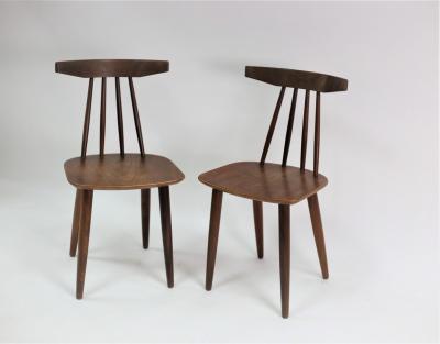 Appraisal: A pair of Danish teak stick back chairs by Frem