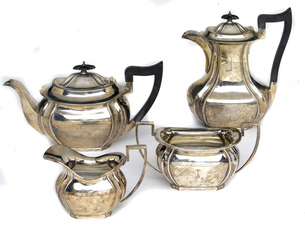 Appraisal: A GEORGE V TEA AND COFFEE SERVICE of moulded oblong