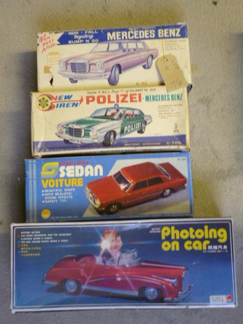 Appraisal: Four boxed tin plate cars Photoing On Car battery mystery