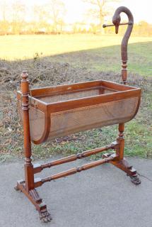 Appraisal: th century Mahogany framed babies cot with swan head finial