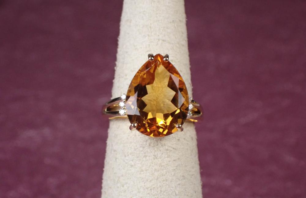 Appraisal: CITRINE DIAMOND AND FOURTEEN KARAT GOLD RING The yellow gold