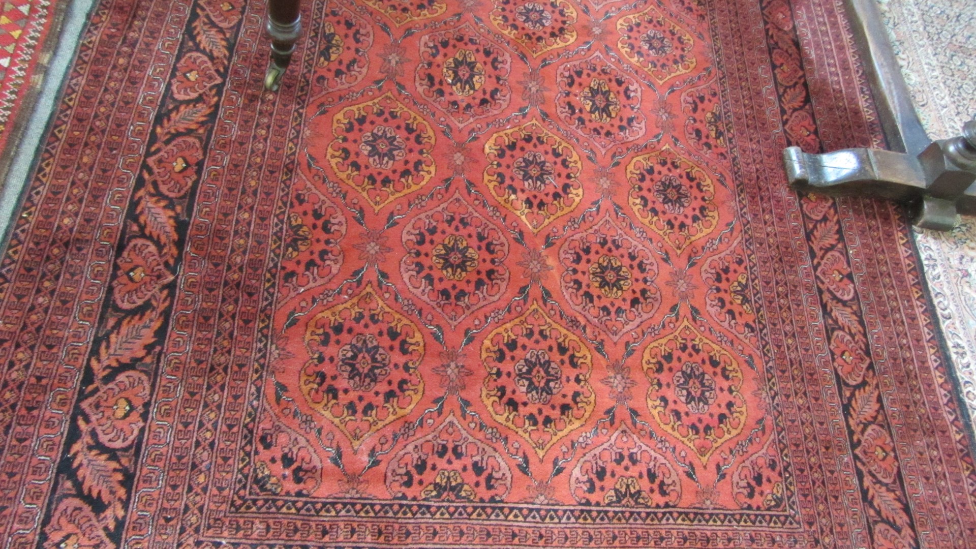 Appraisal: An Beshir carpet the madder field with interlocking cartouches with