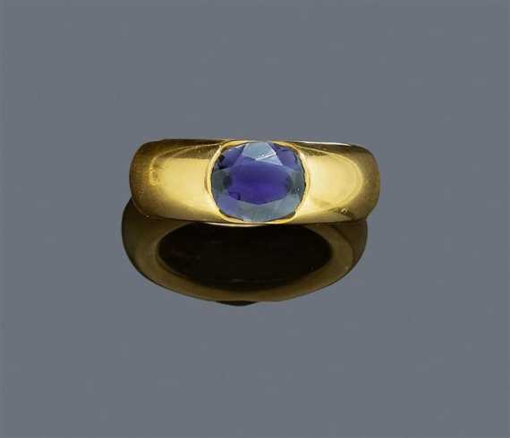 Appraisal: IOLITE AND GOLD RING CARTIER ELLIPSE Yellow gold Broad band