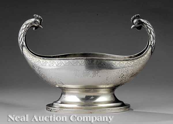 Appraisal: A French Figural Silver Centerbowl navette-form with handles modeled as