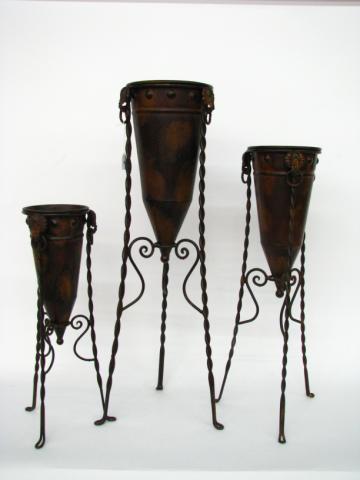 Appraisal: Three decorative metal copper finish planters with elephant motif handles