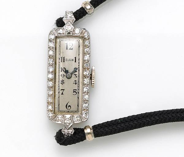 Appraisal: A diamond platinum iridium metal and chord ladies wristwatch Elgin