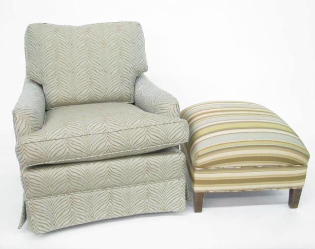 Appraisal: An upholstered club chair and ottoman decorator quality with coordinating