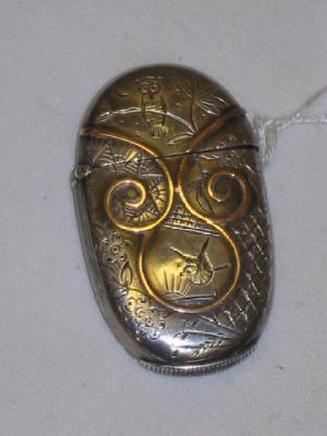 Appraisal: A VICTORIAN AESTHETIC VESTA CASE of oval form applied with