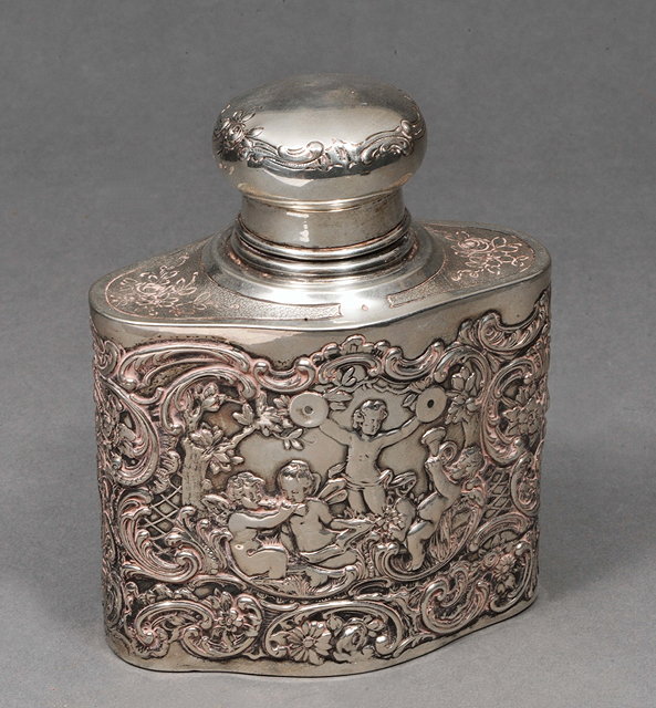 Appraisal: A CONTINENTAL SILVER OVAL SHAPED TEA CADDY with pressed groups