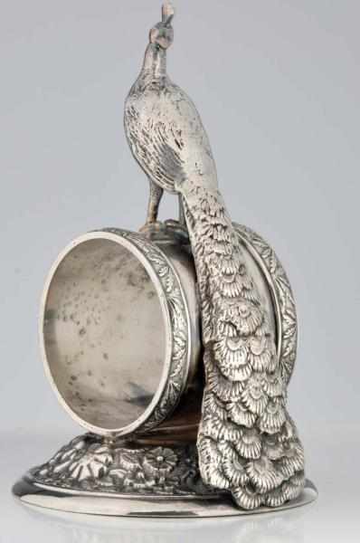 Appraisal: Peacock Atop Holder Figural Napkin Ring Holder on domed round