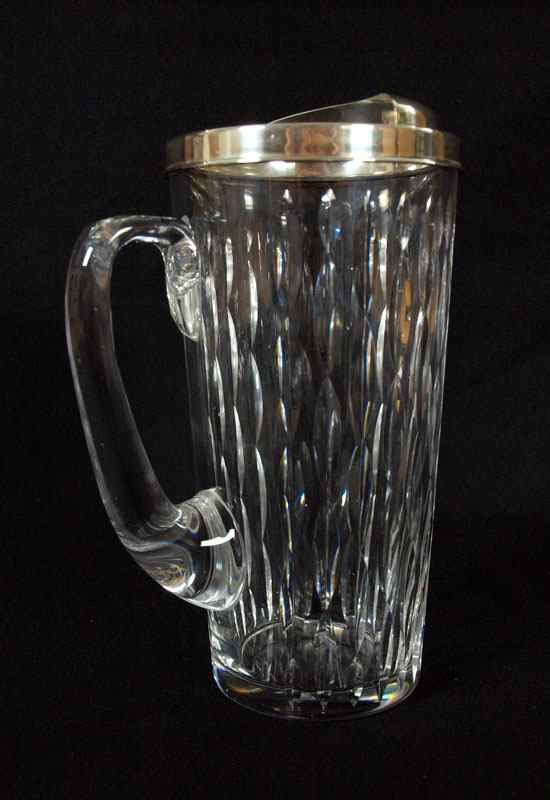 Appraisal: TIFFANY CO STERLING MOUNTED COCKTAIL PITCHER Sterling rim and ice